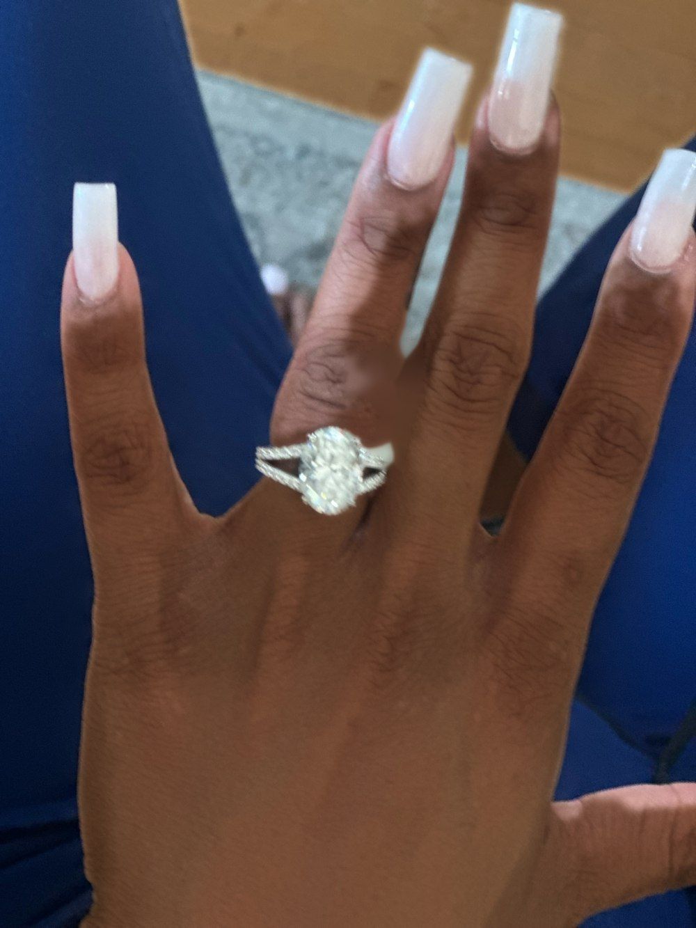 Finished oval split shank ring photographed on the hand